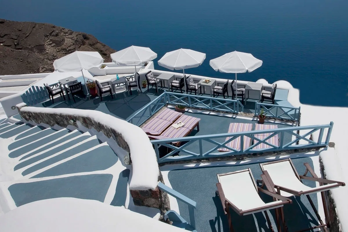 Whitewashed Aspa Villas terrace overlooking the Aegean Sea
